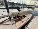 a sail boat that is docked in the water