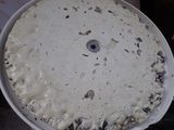 a white plate with a pie in it sitting on a table