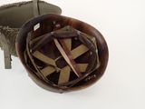 a small wooden bowl with a leather handle and a brown strap