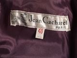 a close up of a purple jacket with a label on it