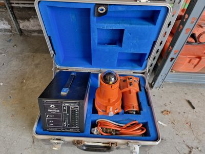 a tool in a case that is sitting on the floor
