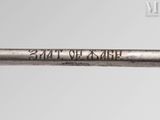 a close up of a metal pipe with writing on it