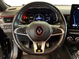 the interior of a car with a steering wheel and dashboard controls