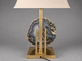 a close up of a lamp with a lamp shade on top of it