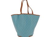 un sac fourre-tout bleu avec une poignée marron