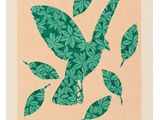 a painting of green leaves on a peach background