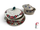 two bowls and a casserole on a white surface