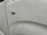 a close up of a car door handle with a sticker on it