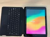 a tablet and a laptop sitting on a table