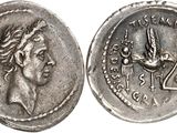 a silver coin with an image of a woman and a bird on it