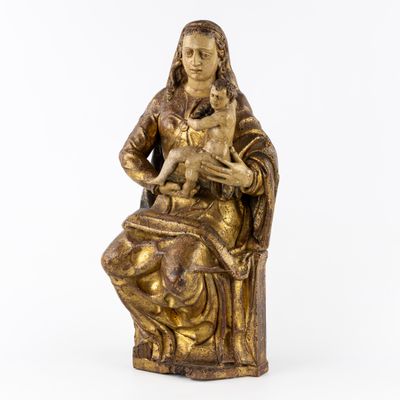 a gold statue of a woman holding a cat on a white background