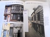 an open book with a picture of a building in it