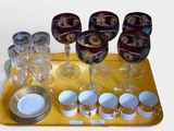 a tray with glasses, plates, and cups on it