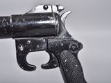 a gun that is sitting on top of a table