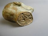 a small statue of a pig on a table