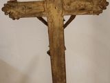 a wooden cross that is sitting on a table