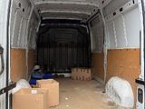 a white van that has some boxes in the back of it