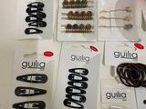 many different types of hair clips on the table