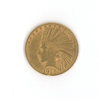 une pièce d'or représentant une tête d'Indien sur un fond blanc