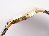 an image of a close up of a watch on a white surface