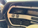 a car dashboard with a clock and a radio in it