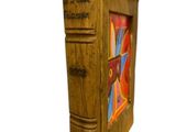 a wooden book that has a picture of a book on it