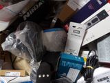 a pile of assorted electronics and electronics on a table