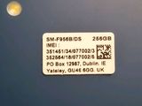 a sticker on the back of a car with a picture of a moon in the background