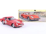 a small red toy car in front of a box