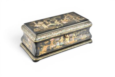 a black and gold box with a painting on it