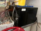 a microwave sitting on top of a counter in a kitchen