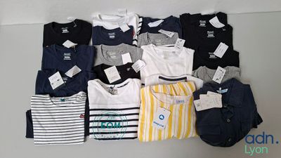 a lot of t - shirts that are on a table