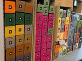 a lot of boxes that are stacked up on a shelf