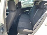 the back seats of a car with a black seat cover