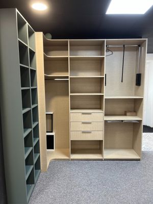 an image of a walk - in closet with shelves and drawers