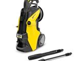 a yellow pressurer with a black handle and a pen next to it