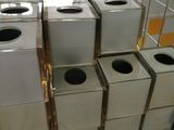 many white boxes stacked on top of each other in a room