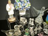 a lot of glass figurines on a black table