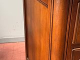 a wooden desk with a drawer on top of it