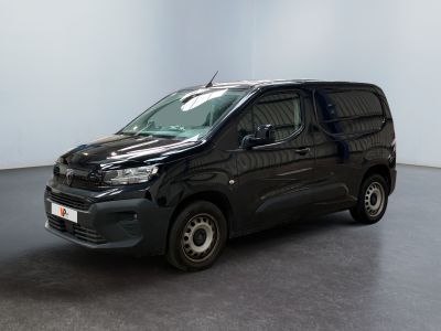 the black van is parked in the empty room of the building