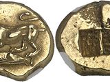 a gold coin with an image of a man on a horse