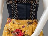 an image of a mannequin wearing a yellow and black floral dress