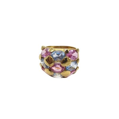 a close up of a gold ring with multi colored stones