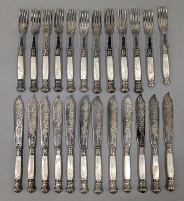 an assortment of silverware including forks, knives and spoons