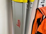 a yellow and black luggage bag sitting next to a yellow and black luggage bag
