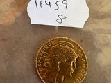 une image représentant une pièce d'or sur laquelle figure une étiquette indiquant son prix