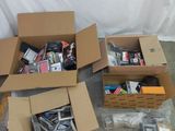 several boxes of assorted electronics are sitting on the floor