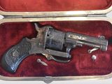 a gun in a case that is sitting on a table