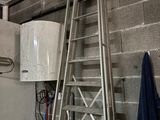 a ladder that is next to a toilet in a room