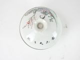 a white bowl with a floral design on it
